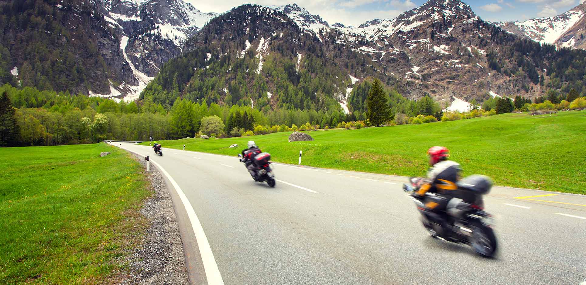 Motorcyclists traveling down a highway