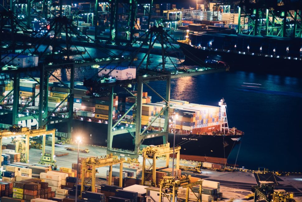 a cargo ship docked at night