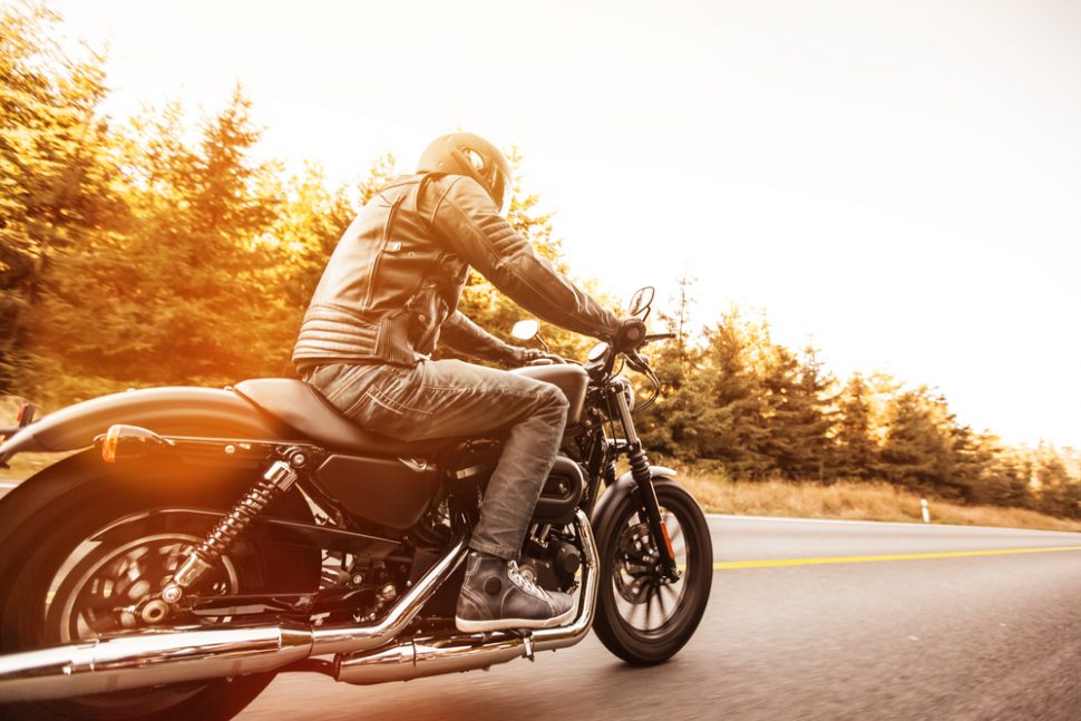 Motorcyclist traveling down a highway