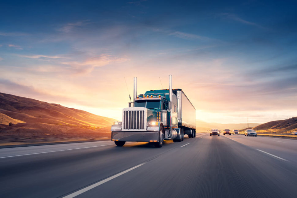 Semi truck traveling down a highway