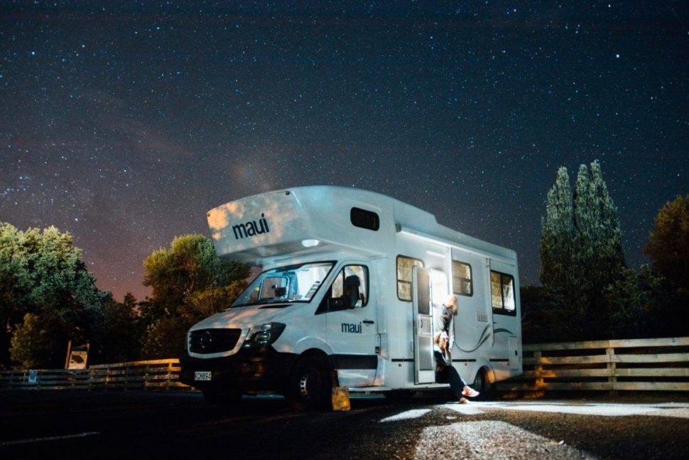 a motor home parked under the stars