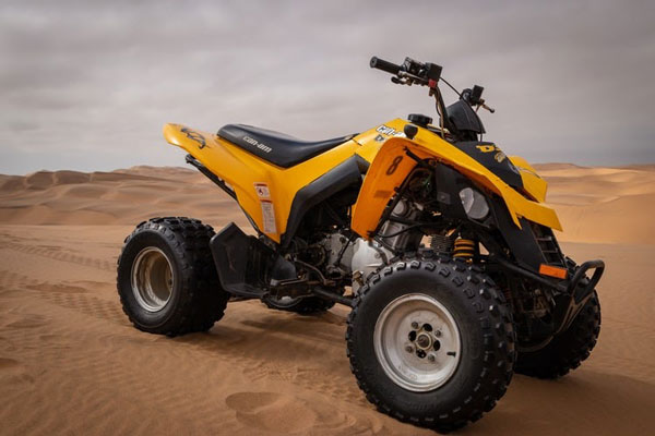 a photo of a yellow ATV