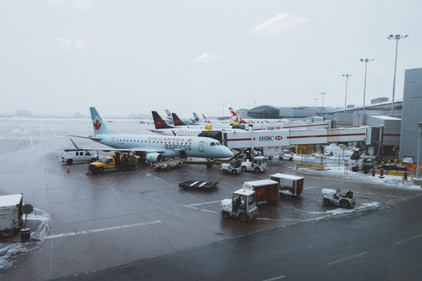 airplanes being loaded at the terminal